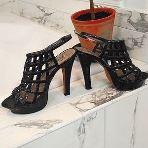 Fergie 5 inch heels with 1 inch platform, black crisscross style, size 7.5